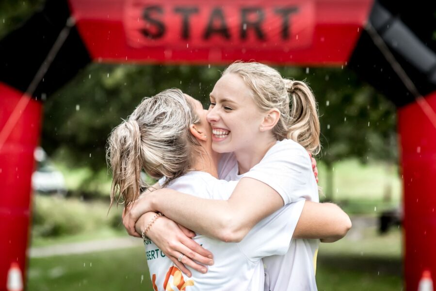 Hospice Run Ladies Hugging at the start line