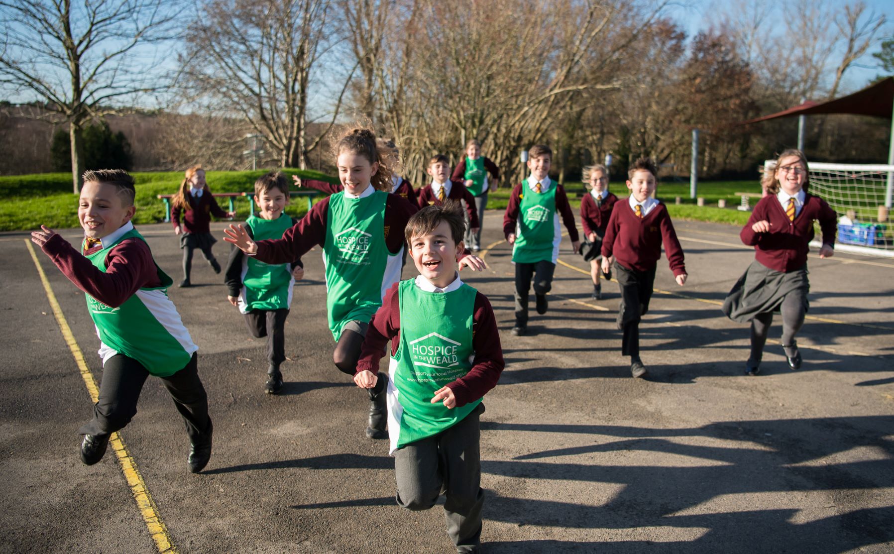 School Children running across playground fundraising