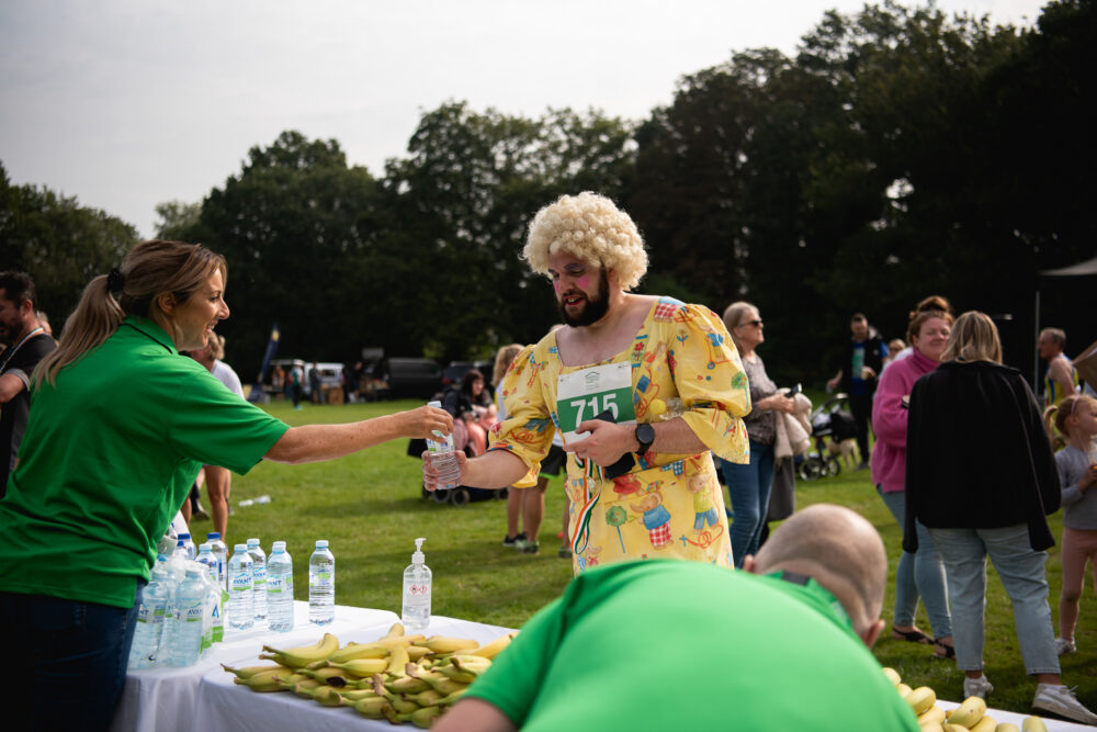 Man in fancy dress at refreshment stand