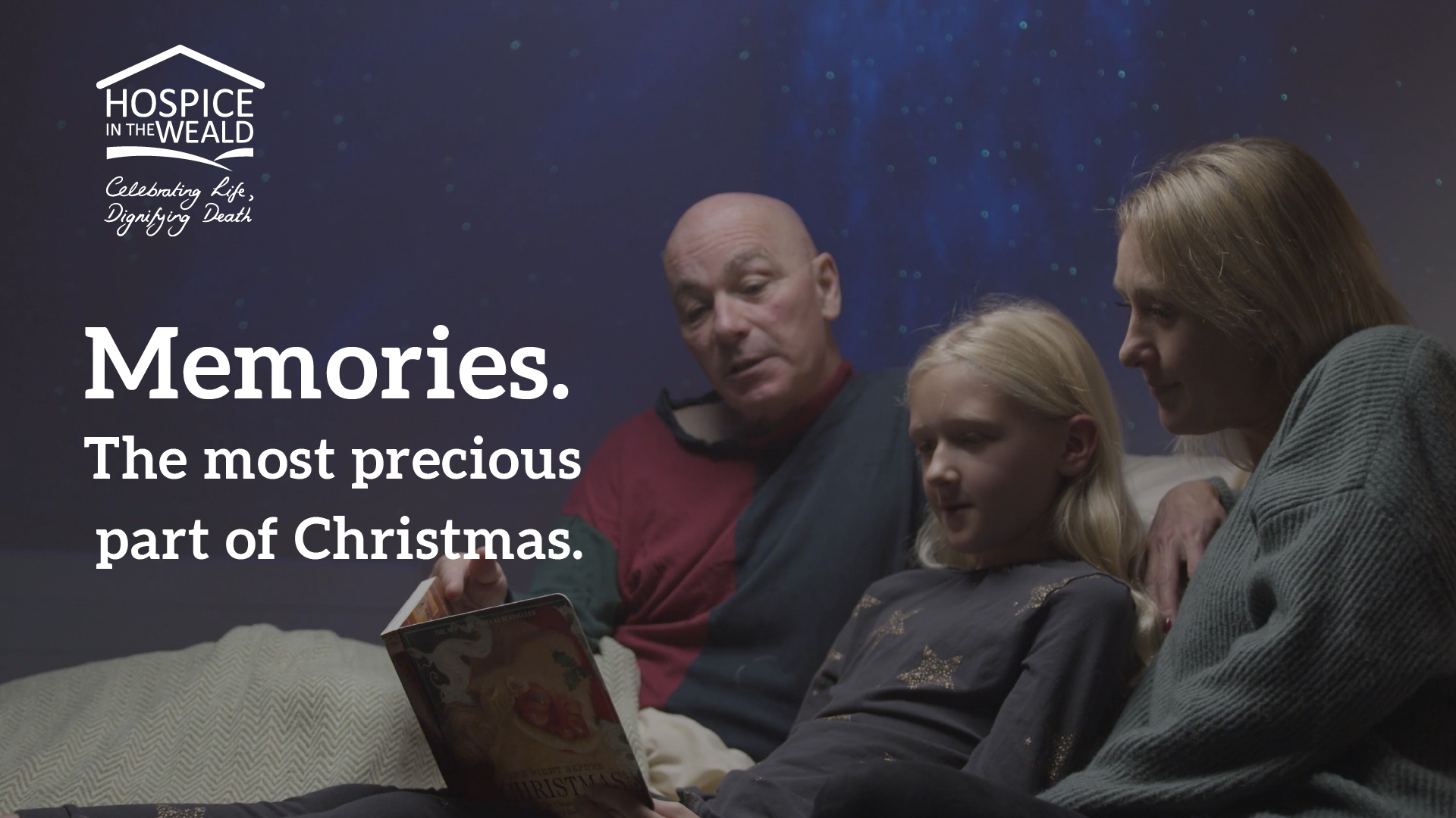 Family reading a Christmas Book at Cottage Hospice, making memories, the most precious part of Christmas