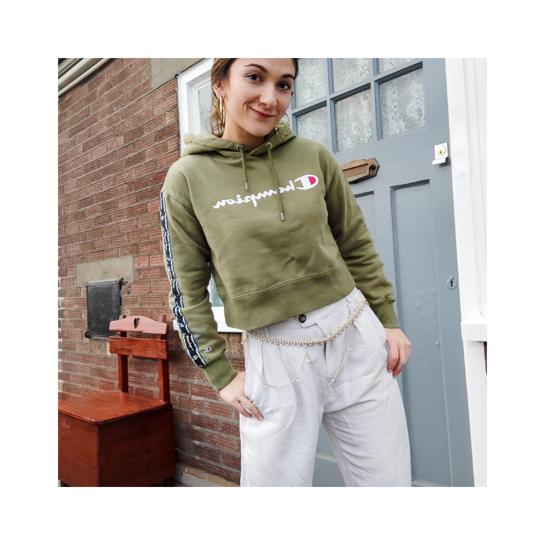 photo in frame of Safia in linen trousers and green Champion hoodie