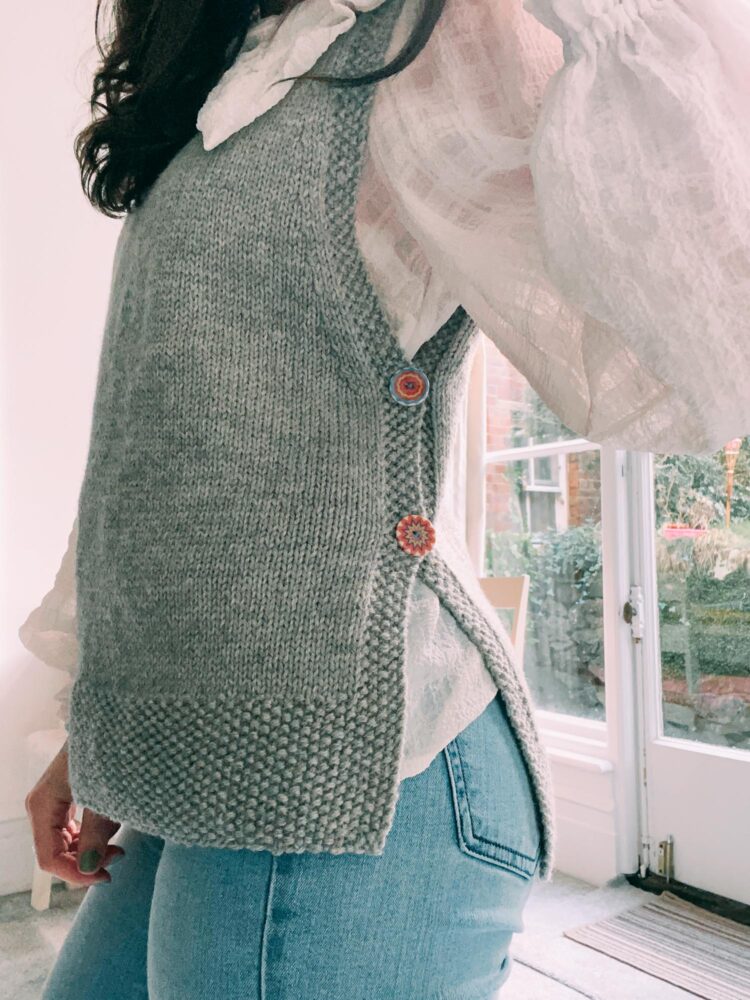 Lucie in jumper vest with button up sides