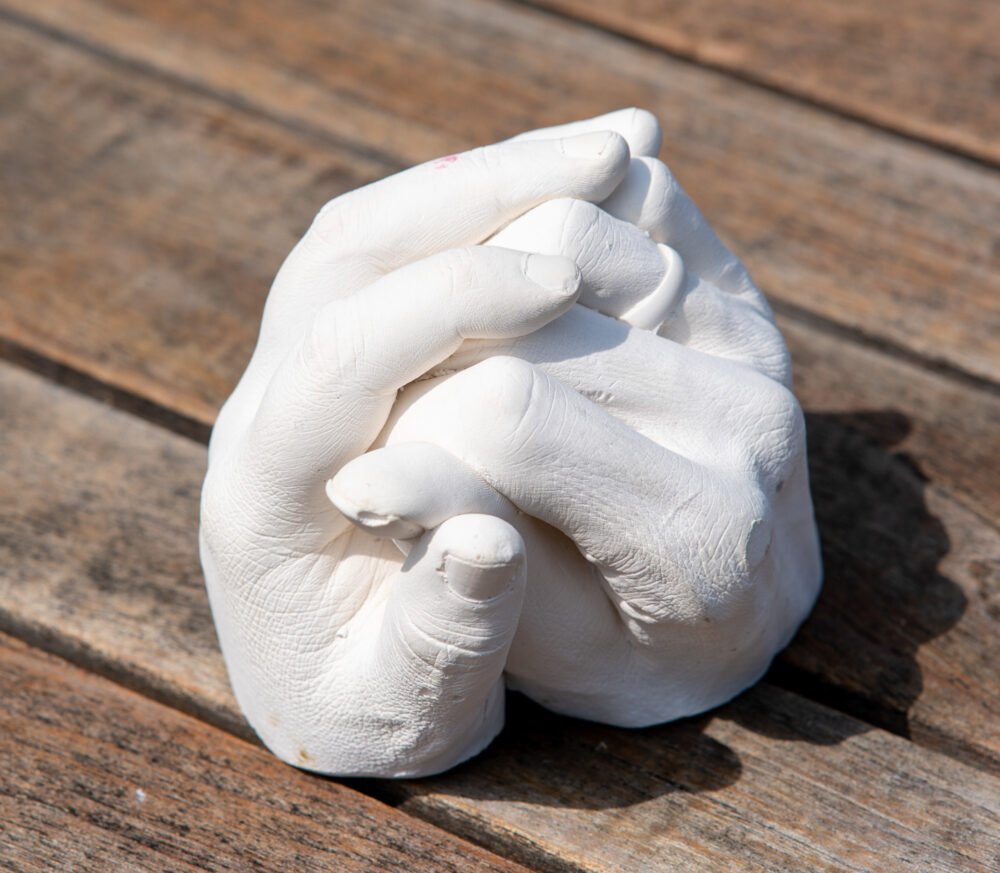 casting made from holding hands with your loved one, cast in plaster of paris