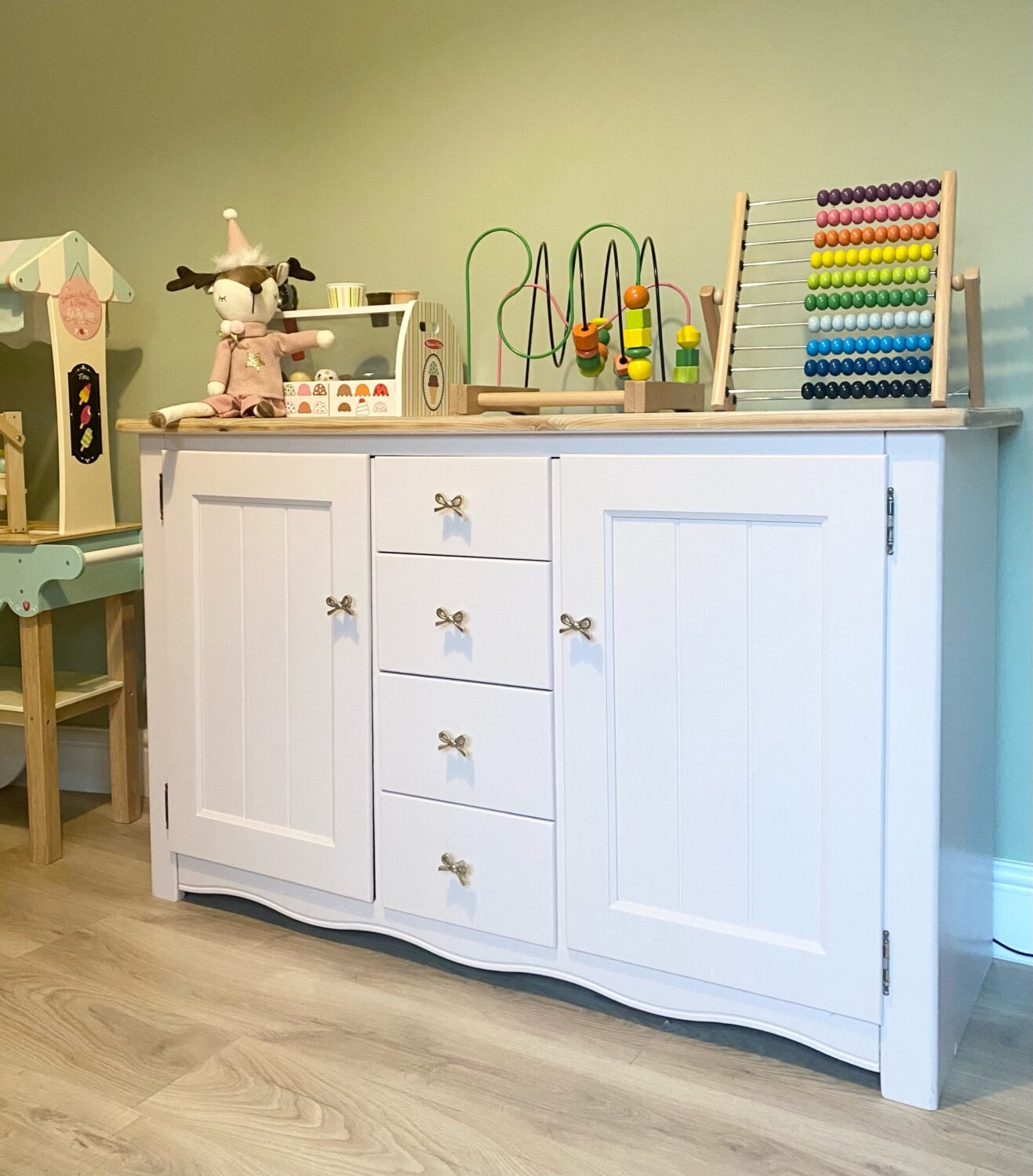 Painted white sideboard in Emma's playroom